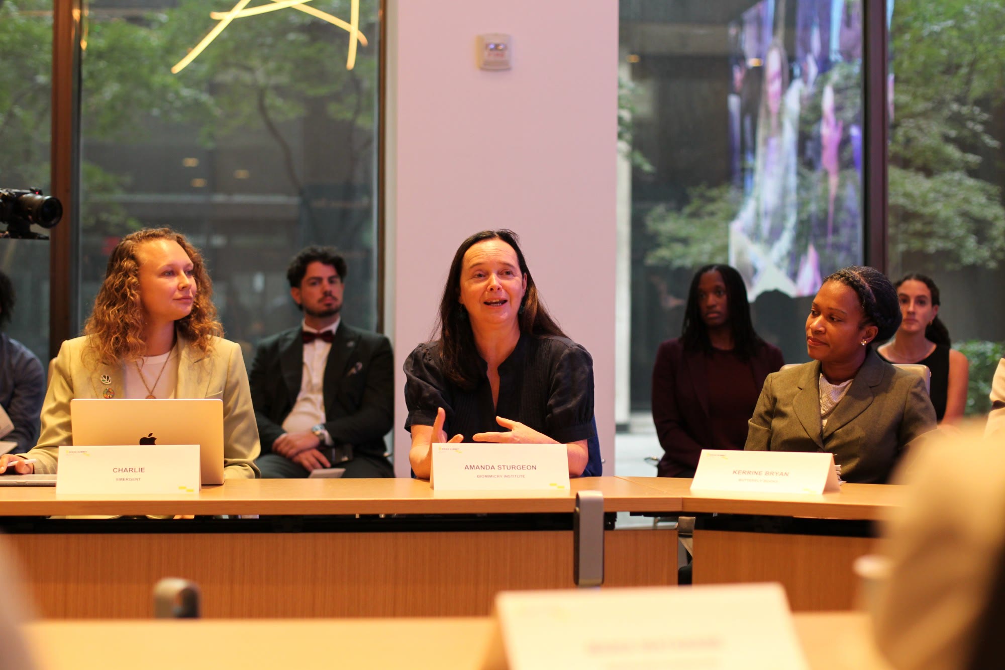 Amanda Sturgeon of the Biomimicry Institute speaks at an Amano So roundtable, beside Charlie of Emergent and Kerrine Bryan of Butterfly Books